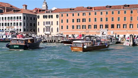 venetian canals: boats and buildings on a sunny day