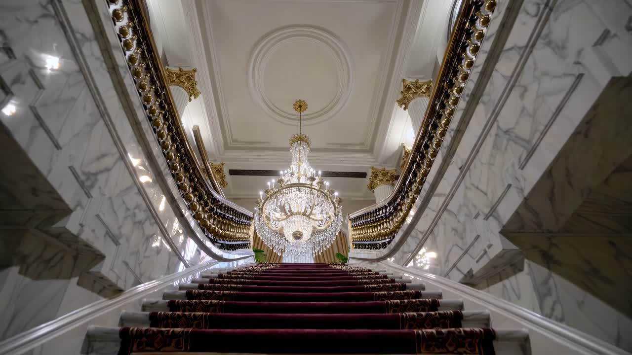 Grand Staircase with Crystal Chandelier in a Luxurious Building