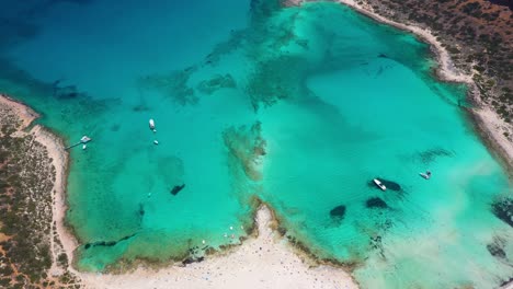 aerial of balos beach and lagoon with turquoise water, mountains and cliffs in crete, greece