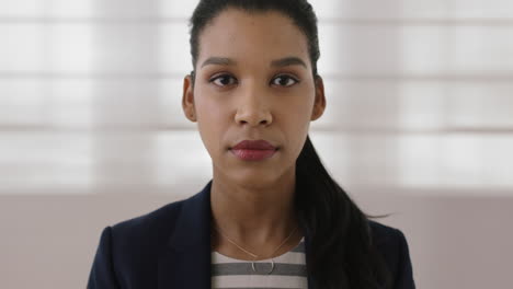 portrait of young mixed race business woman executive looking serious at camera professional female entrepreneur close up