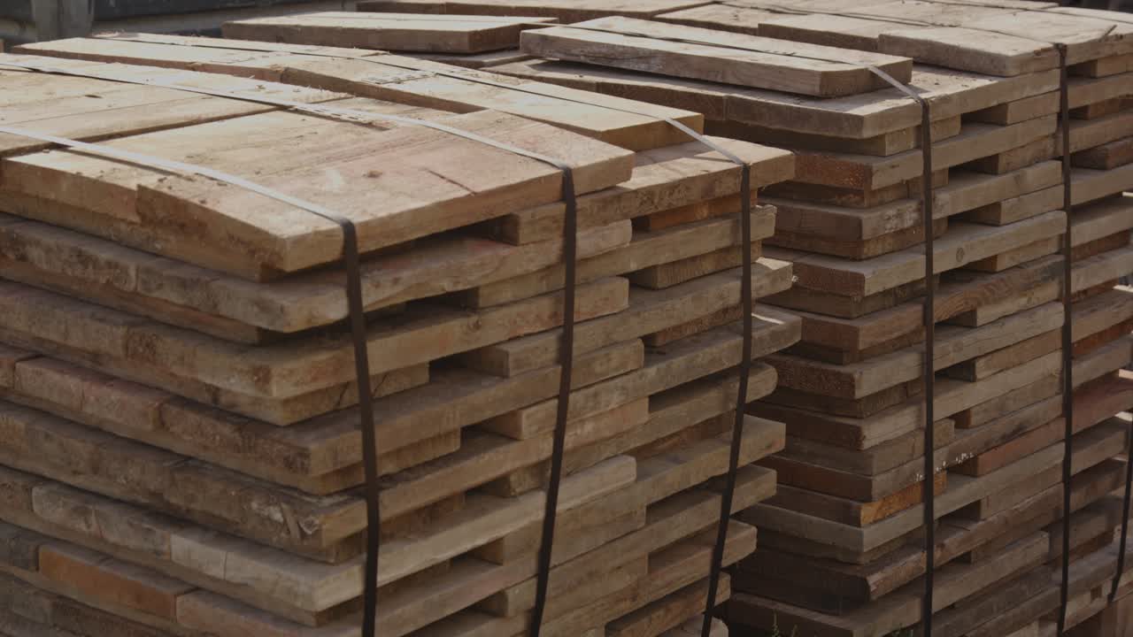 Tilt down of wooden boards on safely tied up on a construction site