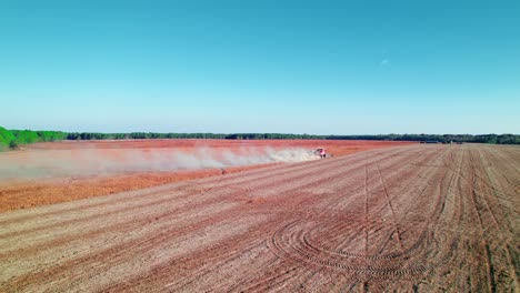 Dust-clouds-rise-behind-a-harvester-in-expansive-Georgia-soy-fields