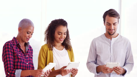 smiling executives using digital tablet