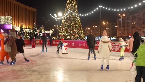 ice skating rink at night with christmas decorations