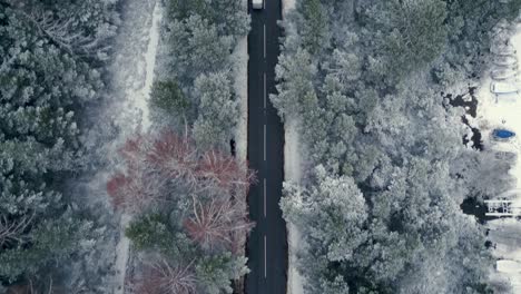 following a road through a winter countryside before revealing a scenic lake