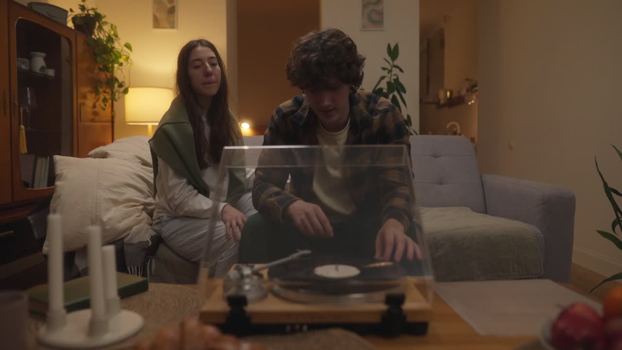 Couple Listening to Vinyl Records at Home