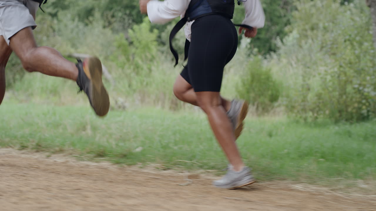 Closeup of two athletes running