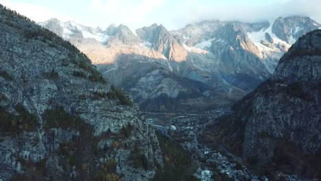 relaxed ascending aerial at iconic mont blanc from courmayeur, italy, aosta valley, italian alps in autumn with fall colors on forest and trees