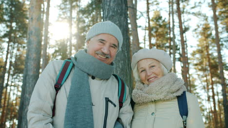 senior couple enjoying a winter day in the forest