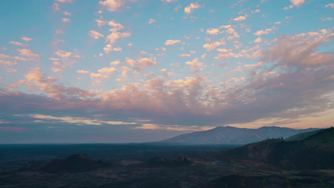 vast volcanic landscape with dramatic sunset sky