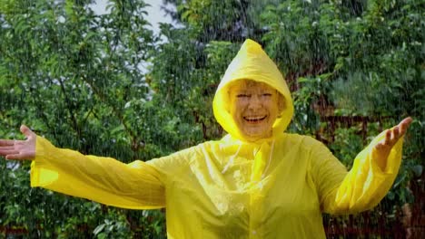 elderly woman enjoying a rainy day