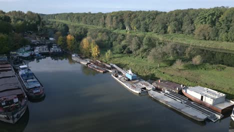 aerial view of the morning marina and anchored towboats in a bay on the elbe river