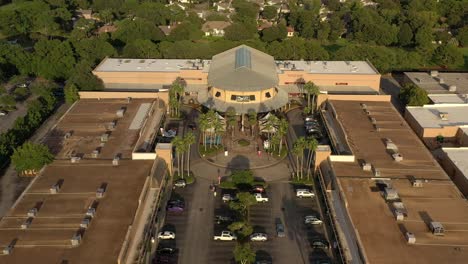 drone view flying away from the center court area of silver sands outlet mall in destin florida