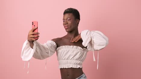 sensual transgender african person taking selfies with the mobile phone