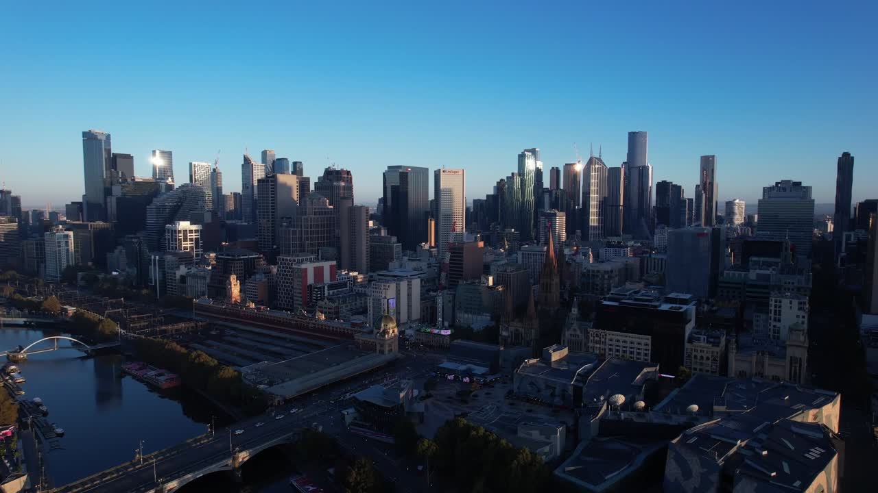 Panoramic drone forward over dramatic city Melbourne in Australia during sunrise