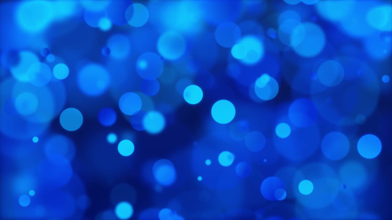 un bucle de fondo de luces de bokeh azules relucientes y partículas de bokeh azul brillante.