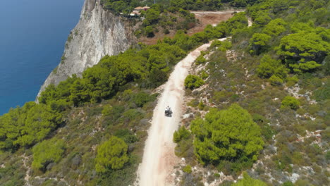 following motorbike journey birdseye aerial view above zakynthos greek island sightseeing coastal cliff edge road