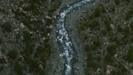 rocky river stream flowing from the mountains at alpe ventina in chiesa, valmalenco, sondrio province, italy