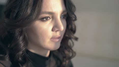 closeup troubled lady with makeup and hairstyle at home