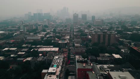 drone-shot-going-backwards-in-Montreal-during-Smog-episode-in-june-2023