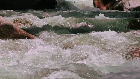 cinematic close up shot of ganges river crystal clear water flowing downstream from mountains in harshal village of uttarakhand