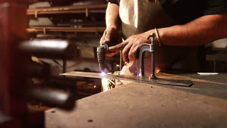 mid-section of welder using welding torch