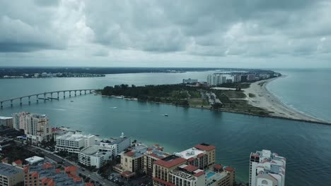 aerial view of causeway bridge and hotels  in clearwater, florida with dark clouds