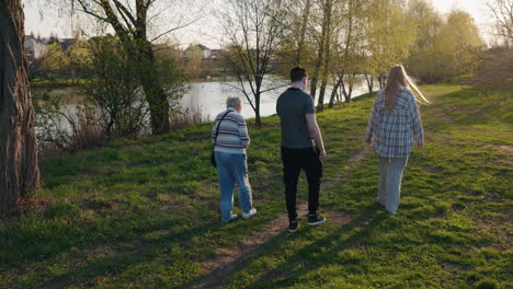 family walk by the lake