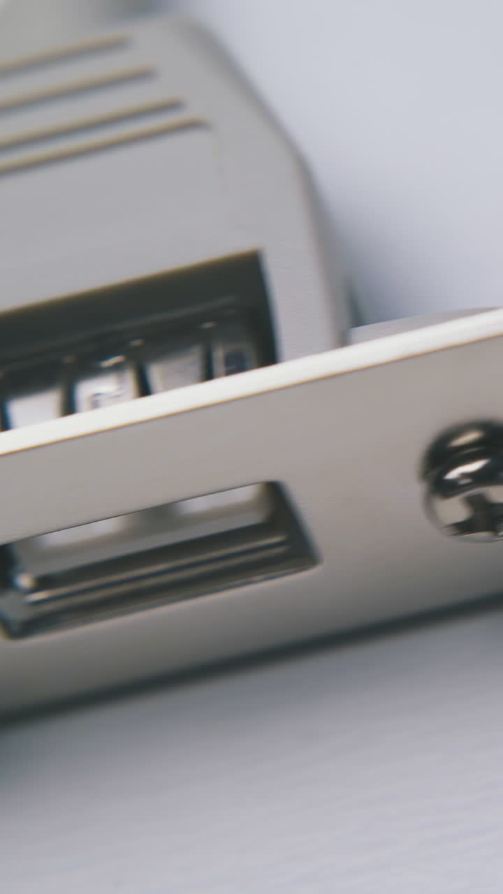 new modern inner usb hub with metal plank lies on clean white background extreme close view