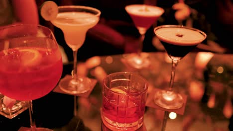 colorful cocktails on a dimly lit table