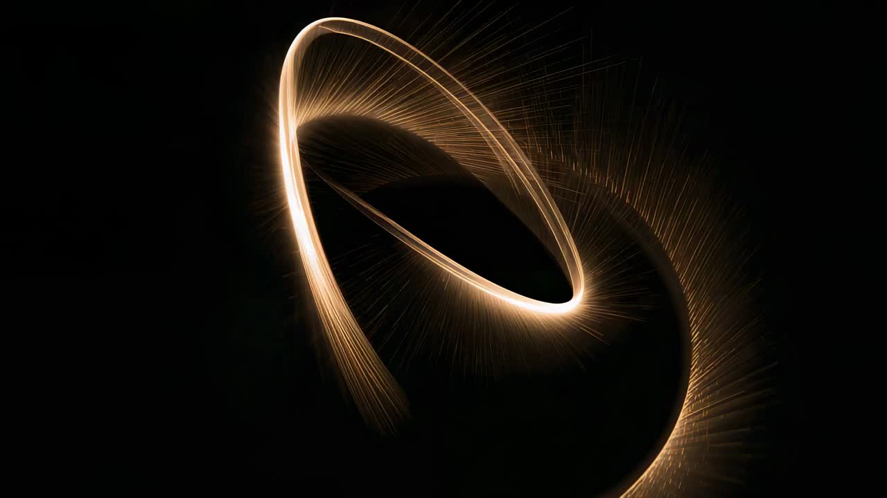 Começando com um arco traçando um ponto de luz, crescendo em uma faixa oval em um palco preto, brilhando e formando um loop
