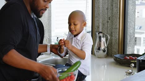 family preparing food in kitchen at home 4k