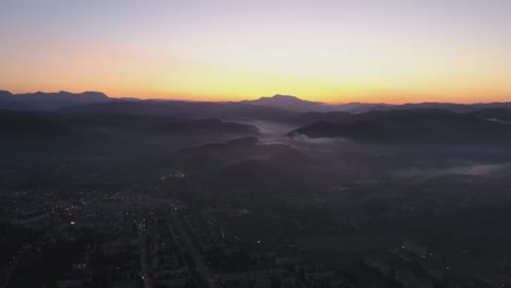 Fog-above-the-city-in-sunset-time