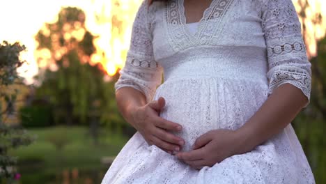 Pregnant-woman-feeling-happy-at-garden-home.