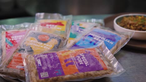 variety of frozen processed meats with colorful labels