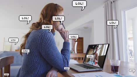 Retro-speech-bubbles-with-lol-text-floating-against-woman-having-a-video-call-on-laptop-at-home