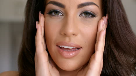 close up attractive woman face with two hands