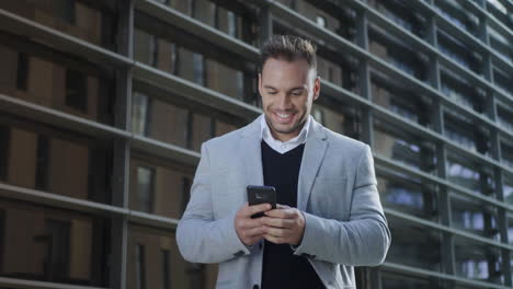 businessman reading good news on smartphone