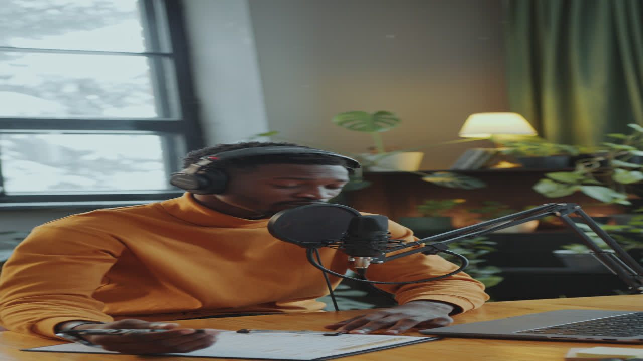 African American Journalist Recording Audio Podcast at Studio