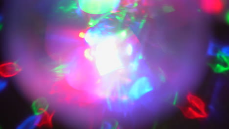 futuristic waves, soft light reflections light leaks from disco ball. projection on the wall. fast moving abstract colorful particles, reflections, shadows 4k footage.