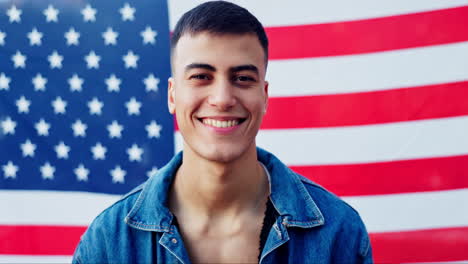 portrait of a man smiling in front of an american flag