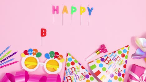 party accessories and happy birthday candles ordering on pastel pink theme. stop motion
