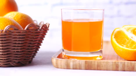 Orange-juice-in-glass-on-table