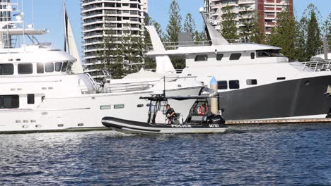 police boat patrolling near yachts in gold coast harbour