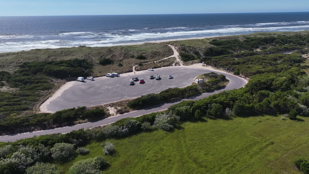 Aerial view over a parking lot, toward the Heceta Beach, Oregon coast, USA