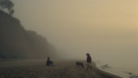 lovely couple spending time on beach. boyfriend and girlfriend relaxing at ocean