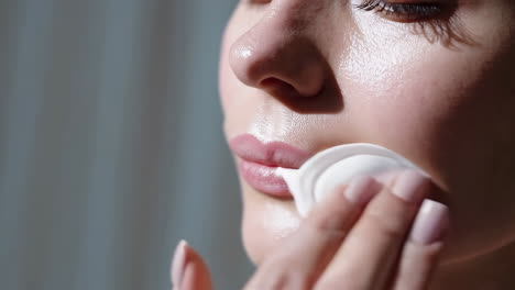 Woman Applying Facial Cleansing Pad