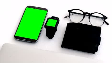 electronic gadgets, wallet and spectacles on white background 4k