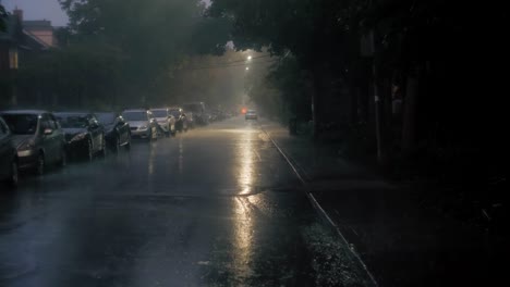 establishing shot of a ity street at night during a storm.