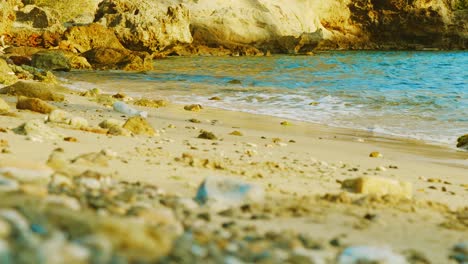 rocky beach shore with ocean waves on the background in willemstad, curacao